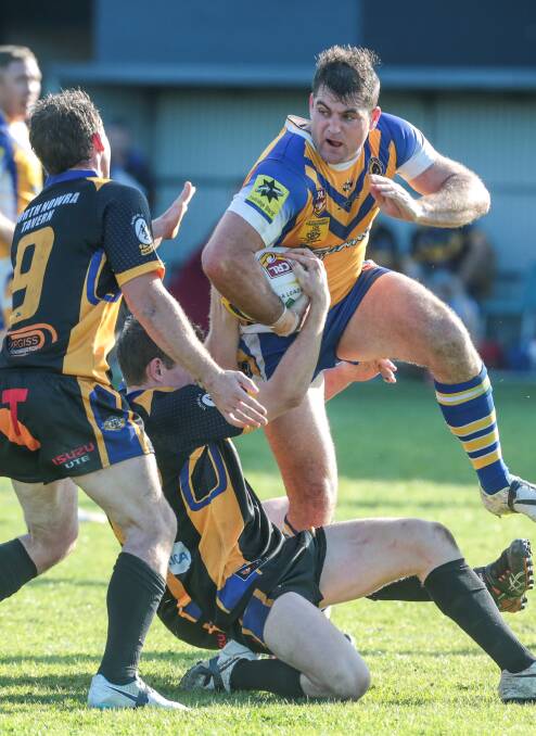 A rampaging Aaron Henry on the charge during last year's grand final. Henry has remained with the Gorillas and will again lead their attack.