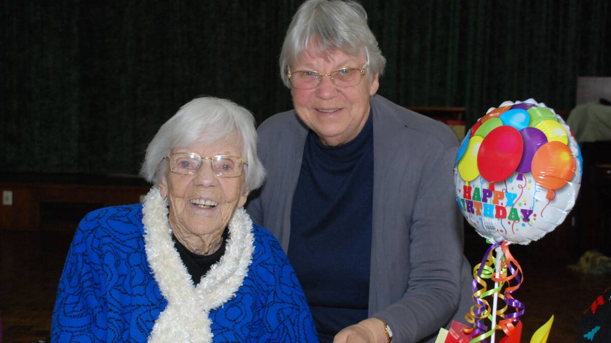 Centenarian Lilian Wood and her daughter Cate Waterhouse at her surprise party at Friday Friends. Picture: DAVID HALL