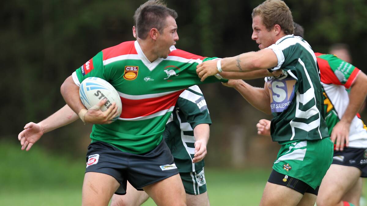 Jamberoo Superoos second-rower Robbie Noble tries to fend off a Como-Jannali defender during last week's trial.