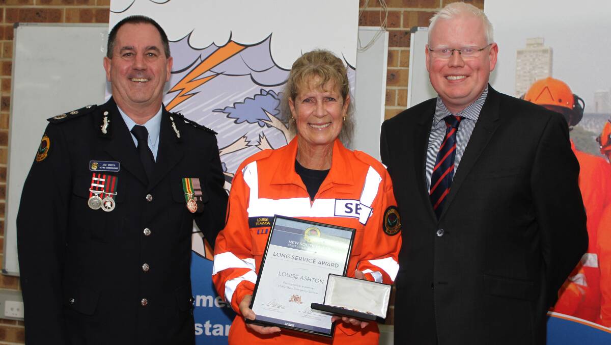 Acting Commissioner of NSW SES Jim Smith, 15-year certificate recipient Louise Ashton and Member for Kiama Gareth Ward. Picture: DAVID HALL