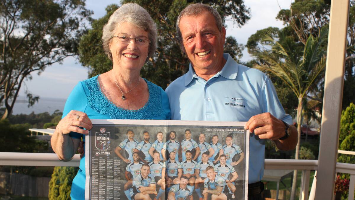 Eileen and Rod Hodkinson with a poster of the NSW team with their grandson Trent bottom right. Picture: DAVID HALL