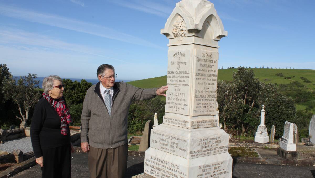Gerringong Historical Society's Margaret Sharpe and long-time Gerringong resident and former Kiama mayor Arthur Campbell at the Campbell family headstone. Picture: DAVID HALL