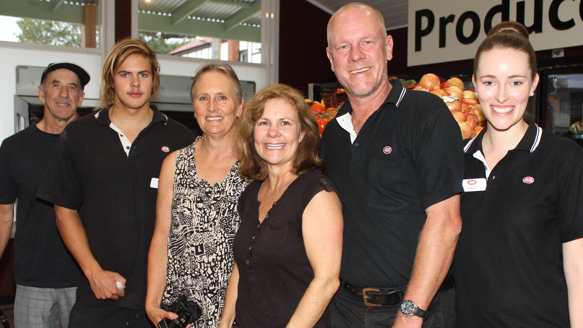 Warren, Luke and Heather Argerakis with Carmel Goldsmith, Trevor Fredericks and long-term employee Laura Thompson after the new shop opened its doors on Friday. Picture: DAVID HALL 