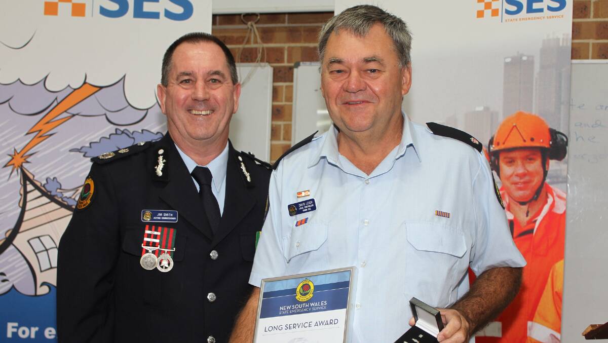 Acting Commissioner of NSW SES Jim Smith presented retiring Kiama SES David Leigh with a Long Service Award. Picture: DAVID HALL
