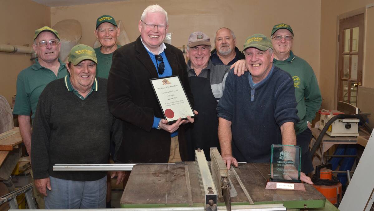 COMMUNITY SPIRIT: Member for Kiama Gareth Ward presented Ken Merrifield from Shoalhaven Heads with the Premier’s Community Service Award on Monday. He is pictured with members of the Shoalhaven Heads Men’s Shed.