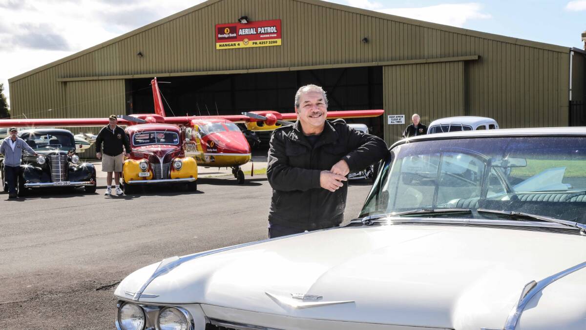 Bendigo Bank Aerial Patrol chairman Harry Mitchell with members of the Romans Hot Rod Club. Picture: GEORGIA MATTS