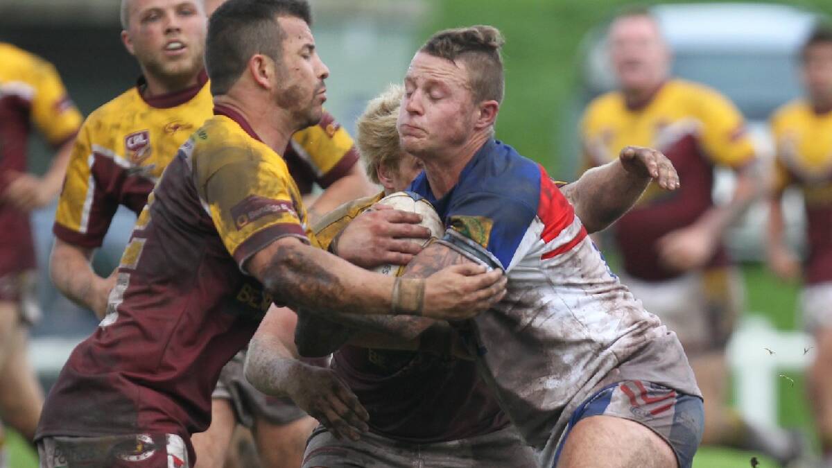 SHELLHARBOUR: Returning Gerringong lock Kal Collins tries to get away from two Shellharbour defenders during Sunday’s clash at Ron Costello Oval. 