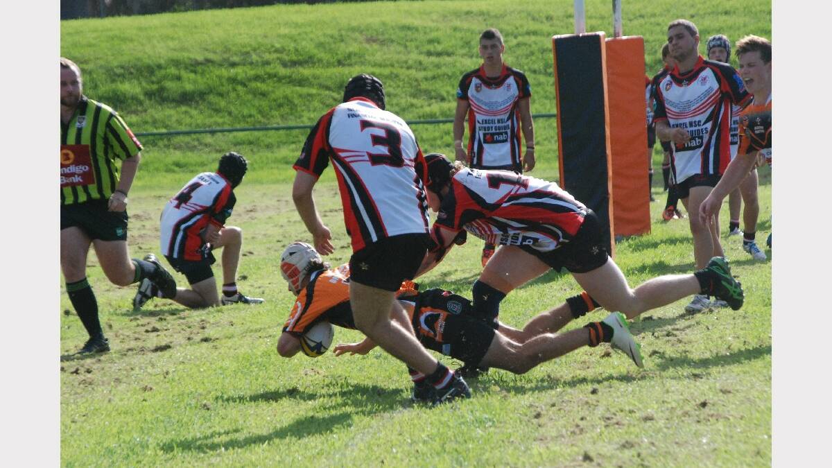 BATEMANS BAY: Bay Tigers under 18s player Lachlan Knox lunges for the line against the Kiama Knights. 