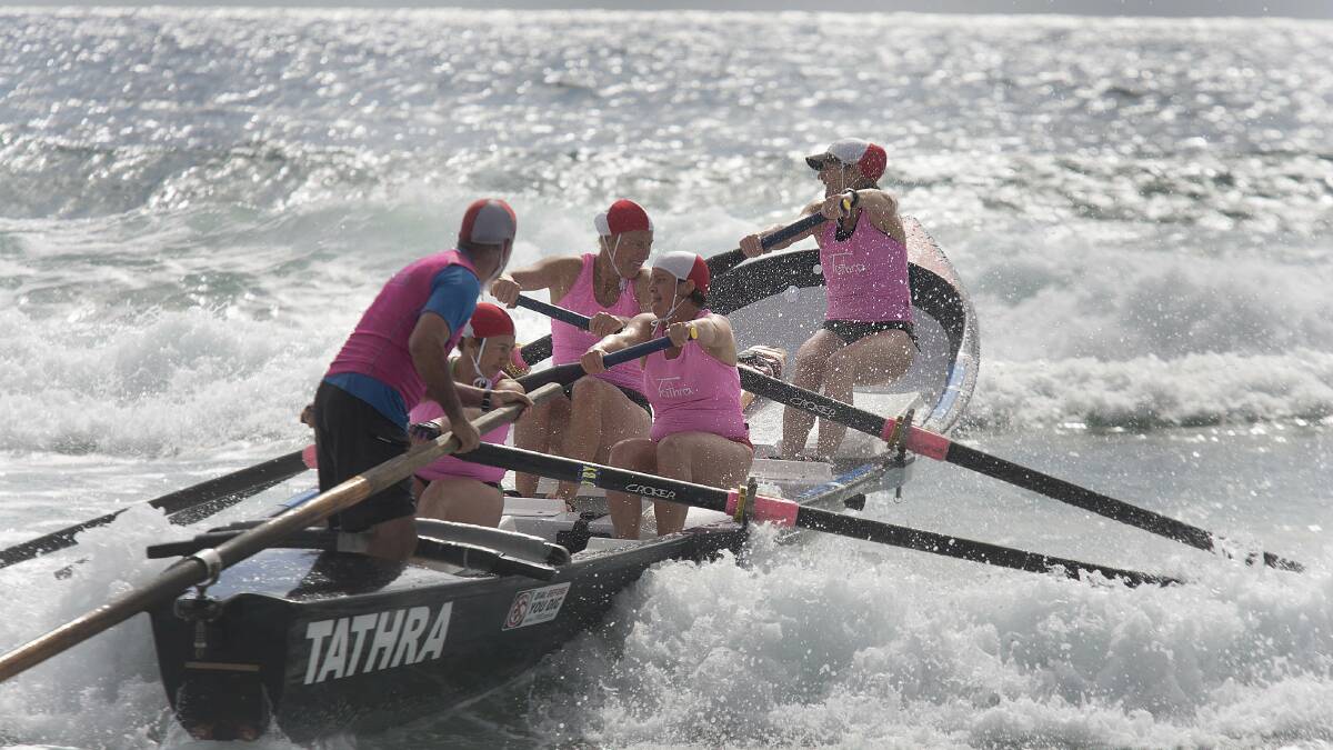 TATHRA: Sweep Geoff Boulton steers the Tathra women’s surf boat team through the rough during the Surf Life Saving NSW Far South Coast branch championships.