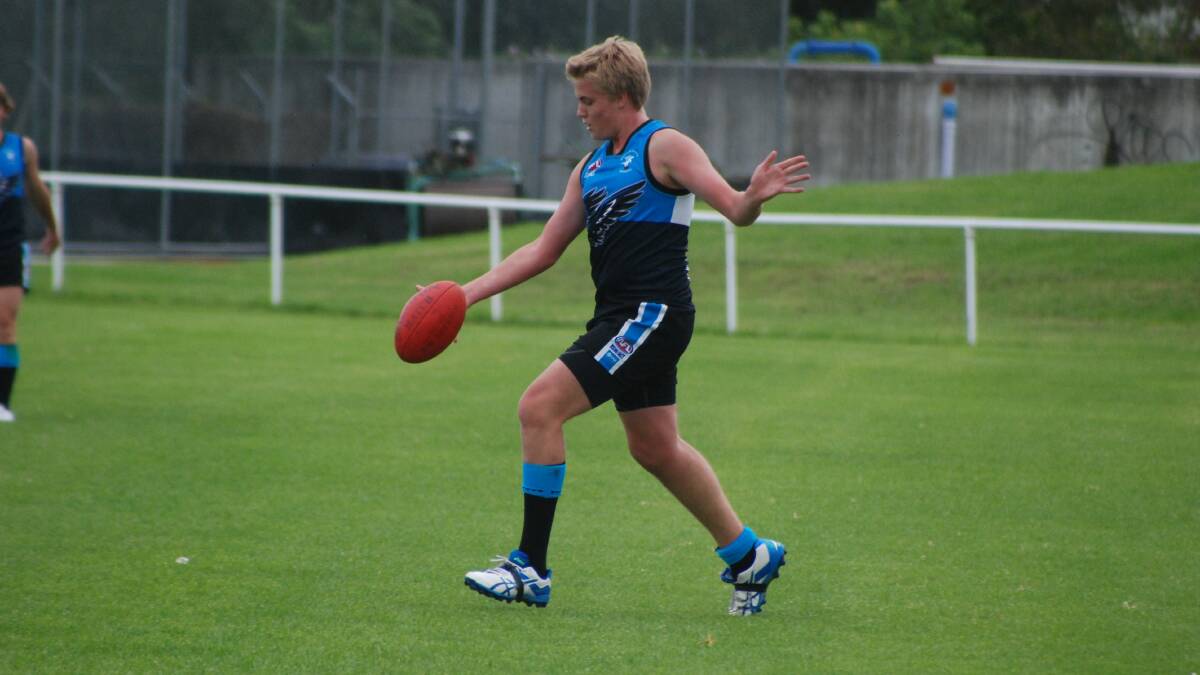 BATEMANS BAY: Under 16s player Michael Thane launches the ball forward against Ulladulla on Sunday.  