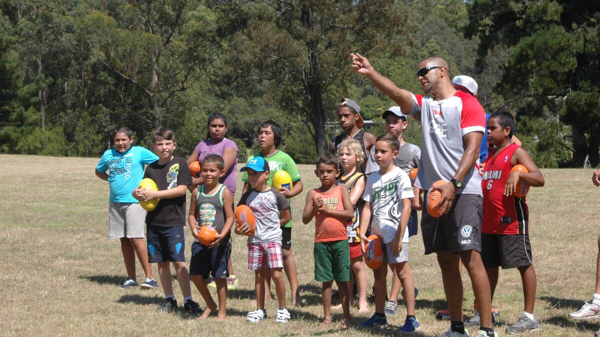  MOGO: Sydney Swan's legend Michael O'Loughlin joined the Mogo Magic Aussie rules club for its registration day and put the juniors through some training drills. 