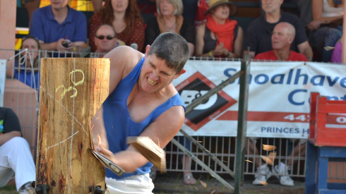 NOWRA: Nowra's Peter Windley was in the zone during the wood chopping section of the Nowra Show on Friday. Photo: JESSICA LONG 