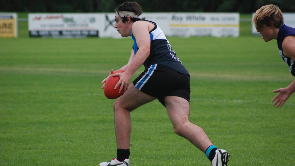 BATEMANS BAY: Seahawks under 16s player Rory McDonald attacks the Dockers defence on Sunday.   