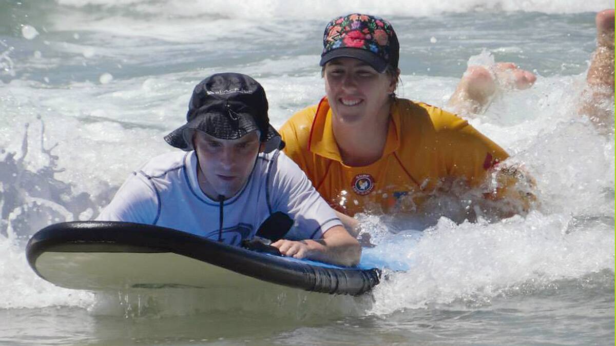 PAMBULA: Kamilla Grubesic (right) leads one of the Special Nippers in on a wave at the Pambula Surf Club’s first Nippers meet recently.  