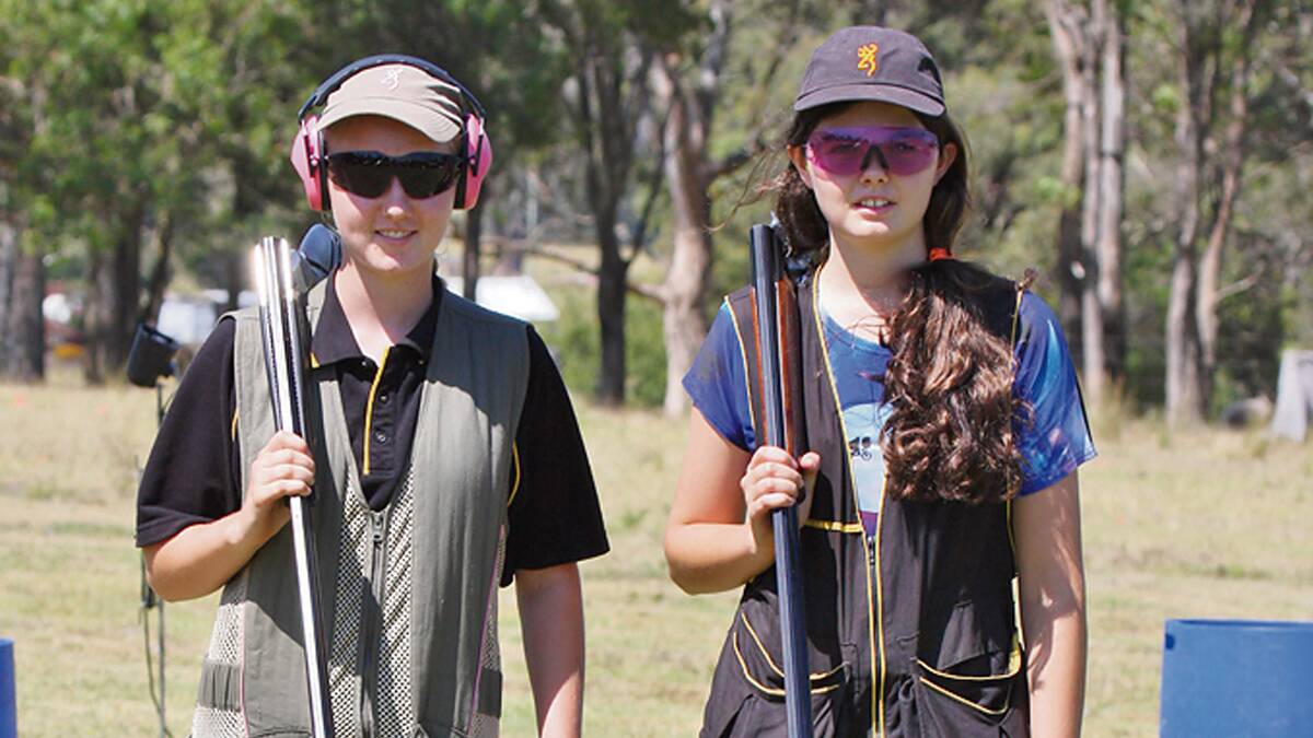 BEGA: The Bega Gun Club’s new junior members Holly and Grace Gschwend try their hand on the range. 