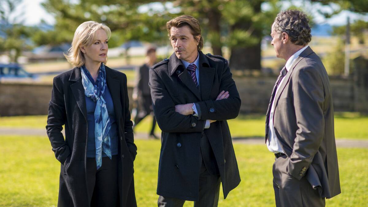 A scene from Winter: Detective Sergeant Eve Winter (Rebecca Gibney) Detective Sergeant Lachlan McKenzie (Peter O’Brien) with Sergeant Steve Wheeler (Richard Healy) at the funeral of murder victim Karly Johansson. 