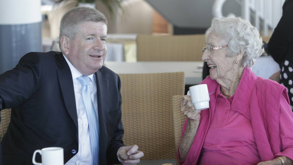 Senator Mitch Fifield chats with resident Norma Bunter over a cup of tea. Picture: ANDY ZAKELI


