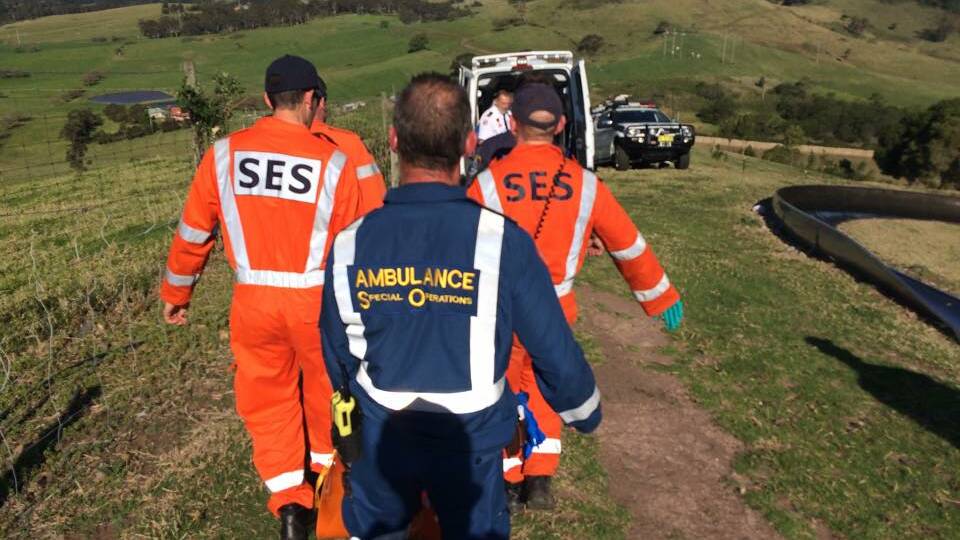 SES and ambulance officials at Jamberoo on Sunday. 