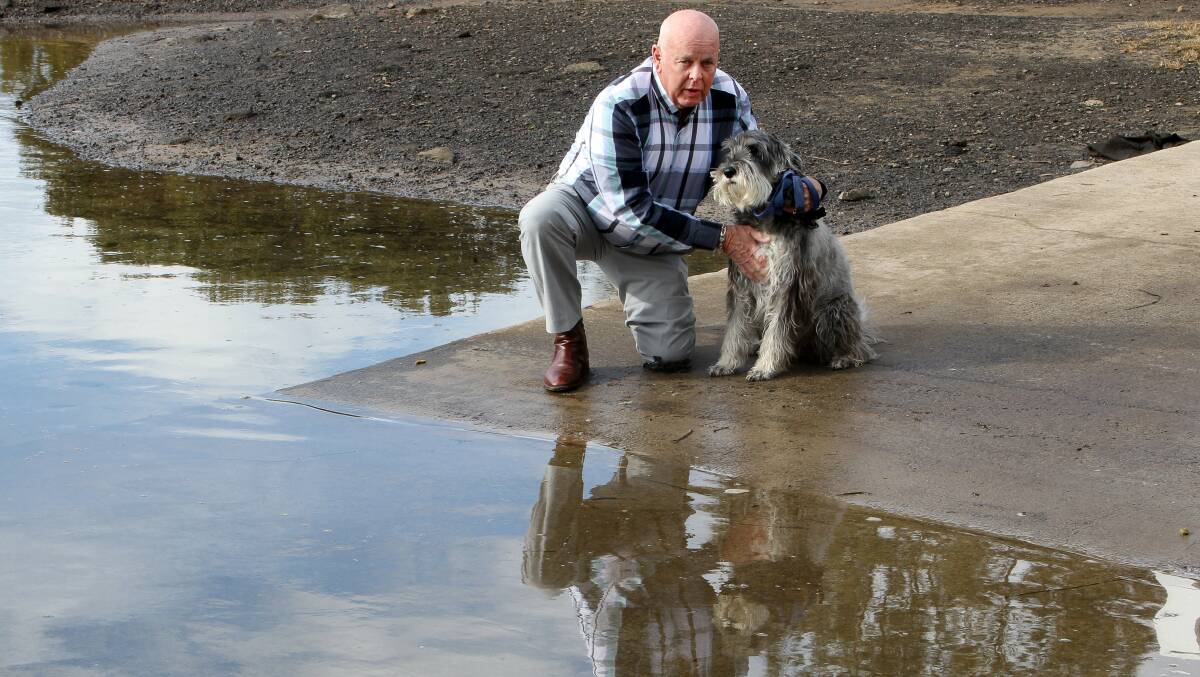 Kiama councillor Warren Steel and his dog Jazz - excited that the dog swimming trial has been given the thumbs up. 