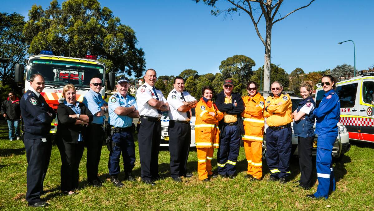 NSW Rescue Services helping out at the launch of Kidsfest Shellharbour. (From left) Insp. Michael Gray (RFS), Pam Dickson (VIP), Raj Kearin (VIP), Sgt. Mark Scott (NSW Police), Norm Rees (ASNSW), David Hitchens (RFS), Christine White (RFS), Ian Cox (RFS), Emma Delaney (RFS), David Kirkwood (RFS), Jordana Cooke (ASNSW) and Erin Hunter (ASNSW). Picture: GEORGIA MATTS