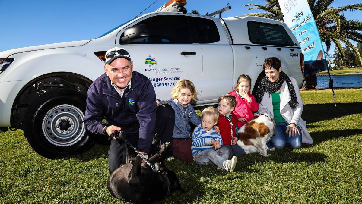 Council Ranger Tom Ward with Kiama residents Ash and Nate and Eric McCorkell, Meg McCorkell and Jane McCorkell with "nanzie's dog" and Renly.  Picture: GEORGIA MATTS