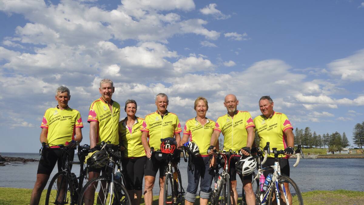Mike Lewis, Tom Curtis, Liz Curtis, Rob Wallace, Sandra Patullo, Peter Patullo and Graham Tink mark the end of their cross-continental bike ride at Black Beach. 