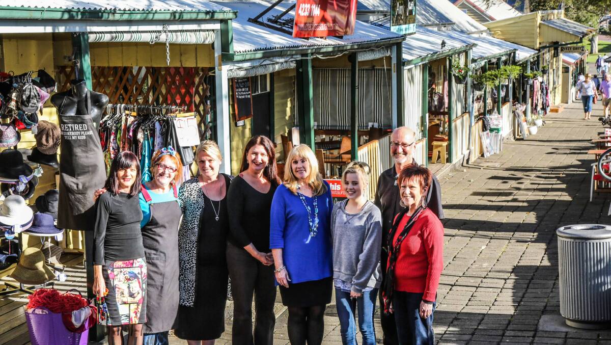 Liz Lindsay, Judy Stephens, Rebecca Jager, Birgit Von der Burg, Pam Harkin, Mollie Gray, Wayne Pottenger and Karla Freeman are shop owners at the Kiama Terraces who are hoping for a grant from council to upgrade the streetscape. Picture: GEORGIA MATTS