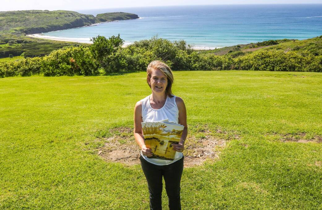 Tourism Shellharbour manager Diane Johnston shows off the soon-to-be-released  visitors' guide. Picture: GEORGIA MATTS 