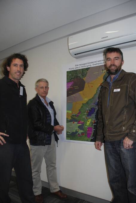 Kiama Municipal Council environmental officer Byron Robinson, Great Eastern Ranges Illawarra facilitator David Rush and OEH Illawarra region senior team leader for ecosystems and threatened species James Dawson map out threatened plant and animal species in the region. Picture PHIL McCARROLL 