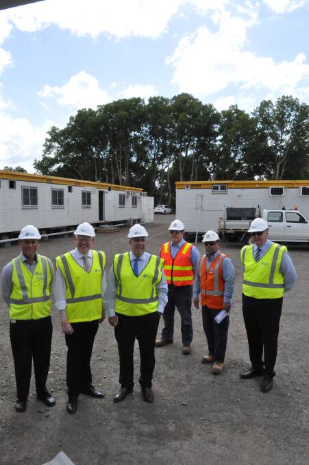 Roads and Maritime senior project manager Ron de Rooy, Kiama MP Gareth Ward, NSW Roads Minister Duncan Gay, Fulton Hogan project director Andrew McRae, Fulton Hogan superintendent Mario Manna and RMS project delivery manager Ron Zahorodny at the site office on Monday. Picture PHIL McCARROLL
