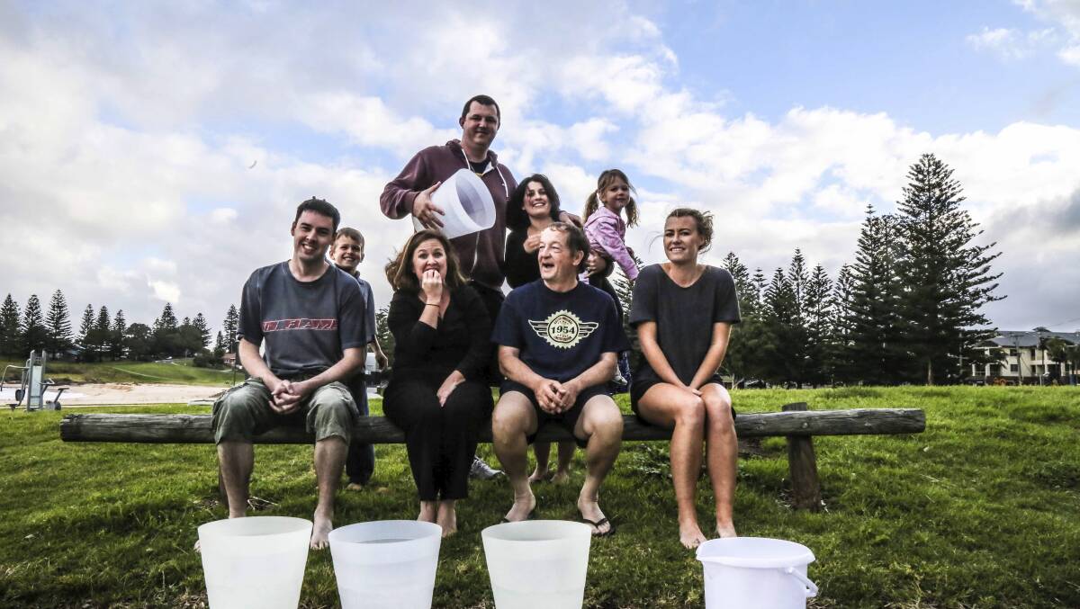 Adam, Kylie, Ajai and  Ciara Regal prepare to do the Ice Bucket Challenge honours on  Kiama Independent/Lake Times  staff Brendan Crabb, Kerrielyn Clark, David Hall and Eliza Winkler. Picture: GEORGIA MATTS