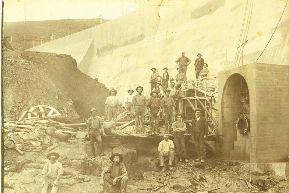  Workers at the completed Fountaindale Dam, circa 1915, and (below) as it is today, operating far below its capacity due to the process of siltation over the decades. Picture: COURTESY KIAMA HISTORICAL SOCIETY