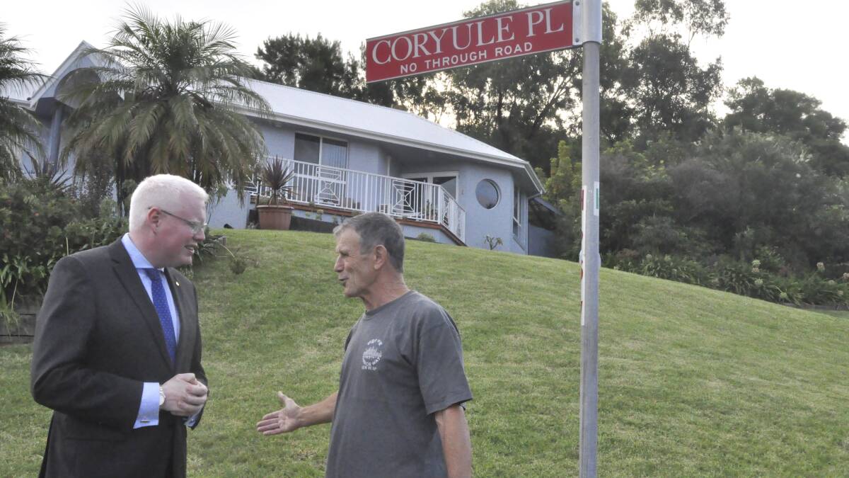 Kiama MP Gareth Ward shares the good news with resident Bob Behl. Picture: BRENDAN CRABB