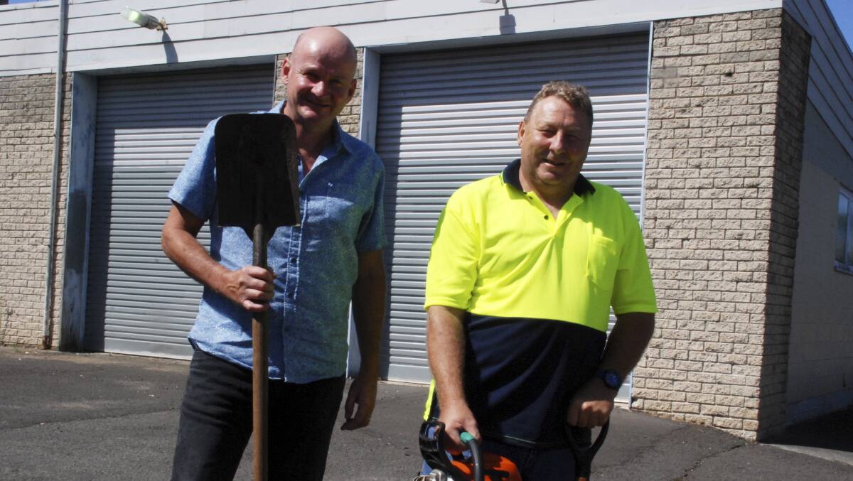 Shellharbour Community Church pastor Shane Cook and church member Mark Tilley outside one of their collection points for building goods at Oak Flats that will help with rebuilding Vanuatu. Picture: DAVID HALL