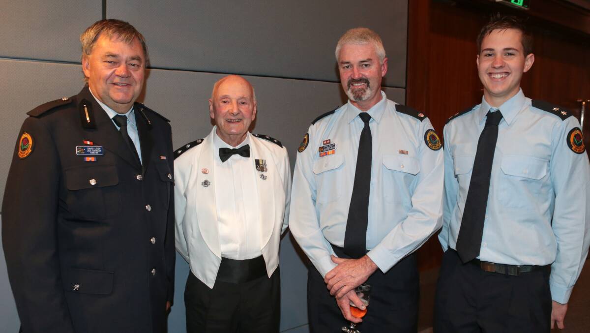 SES officer Grant McClory (second from right) won the major award for professionals at the Pride of the Illawarra awards. With him are David Leigh (left), Lou Fuller, and Owen Pacewicz. bbADAM McLEAN