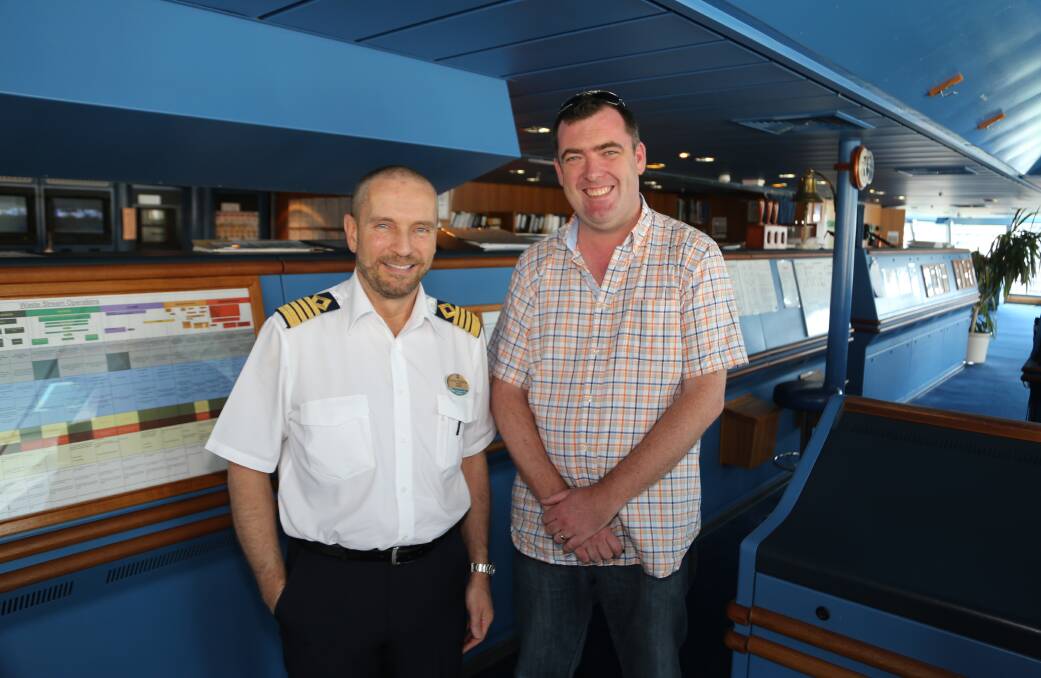 Tourism gathers steam: Radiance of the Seas ship master Captain Goran Peterson with Destination Wollongong general manager Mark Sleigh. Picture: Greg Ellis.
