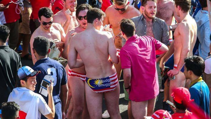 Nine Australian revellers at Malaysia's formula 1 racing circuit have been jailed after stripping down to reveal underpants themed on Malaysia's national flag. Photo: New Straits Times Press/Osman Adnan 