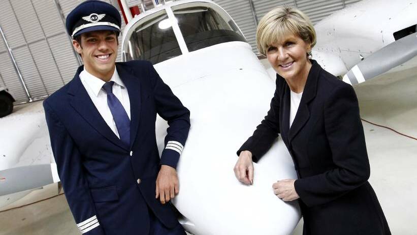HAPPY GRAD: Michael Paris with Foreign Affairs Minister Julie Bishop at the Australian Airline Pilot Academy Rex Cadet Graduation ceremony on Friday. Picture: Les Smith 