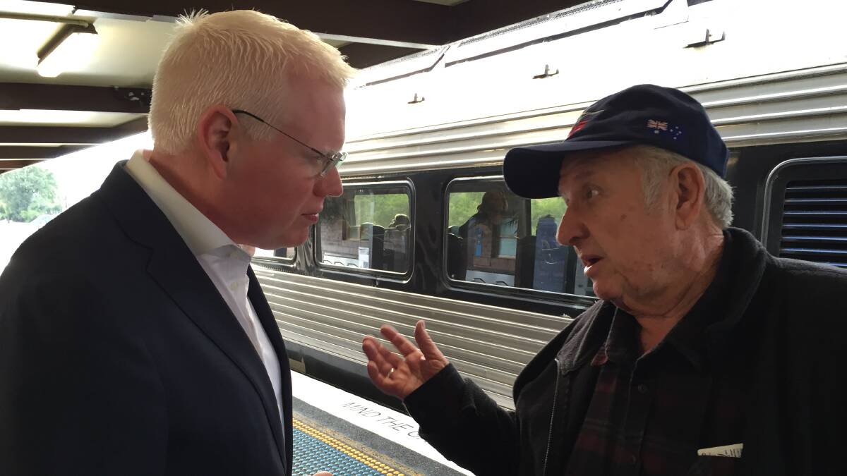 Gareth Ward talks to a local resident about rail issues.
