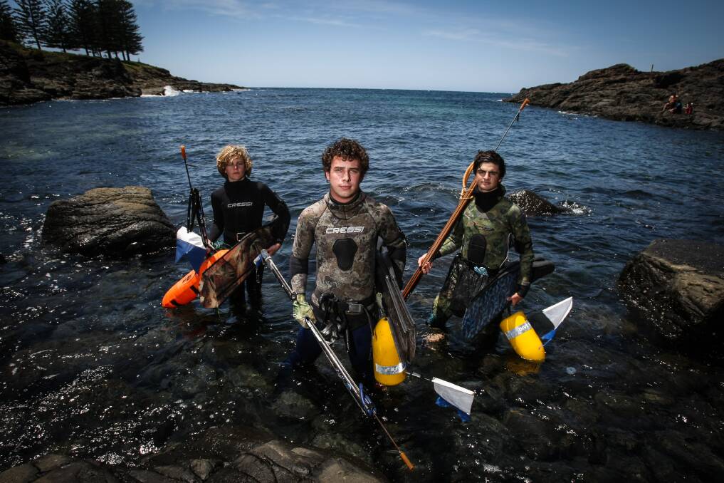 South Coast Sea Snipers members Mitchell Bourke, president Max Gordon-Hall and Jack Loveday have urged spear fishers and skippers to be safe this summer. Picture: DYLAN ROBINSON