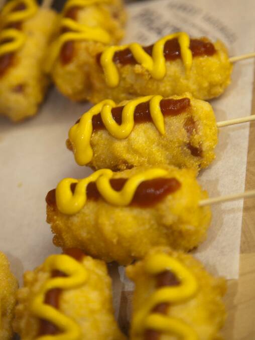 Corn pups with house tomato sauce and mustard at the Phat Brats dogustation.