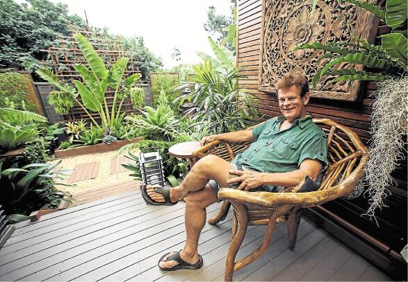 Kiama's Greg Vale in his garden. It took out the Best Small Garden category in the Australian House & Garden Awards. Picture: DANIELLE CETINSKI