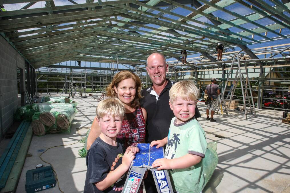 Fredericks IGA owners Trevor Fredericks and Carmel Goldsmith with their sons, Ben and Cameron, checking out the progress of their new store just prior to Christmas. Picture: DYLAN ROBINSON
