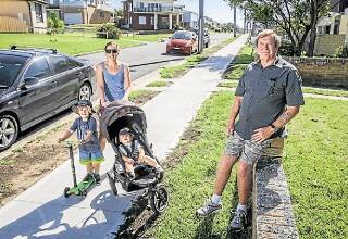 Kiama councillor Mark Way with Jocelyn Quinn and her sons, Lucas and Eli, on the new footpath on Johnson Street. Picture: DYLAN ROBINSON