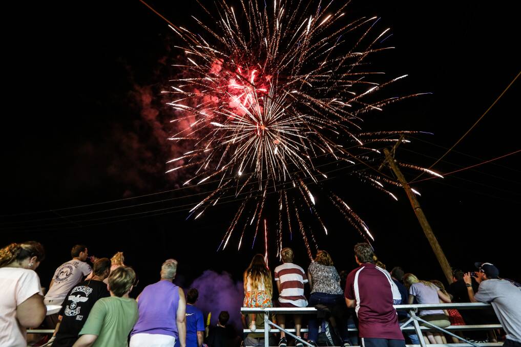 Patrons enjoying the fireworks display in the main arena at the Albion Park Show. Picture: DYLAN ROBINSON