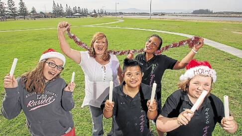 (Left to right) Emily Sims, Shellharbour Mayor Marianne Saliba and members of The Music Makers Jefri Pundavela, Menchie Lowe and Madison Sims at Reddall Reserve. Picture: Picture: Adam McLean