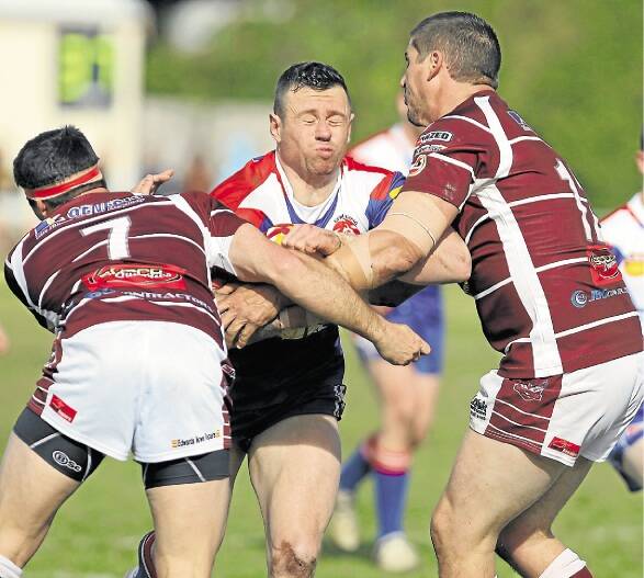 Gerringong Lions front-rower Justin O?Hare comes in for some heavy treatment from Albion Park-Oak Flats' Matt Carroll and Kane Skarratts during the Eagles 20-18 win as they went straight through to Sunday week's grand final. Picture: KIAMA PICTURE CO