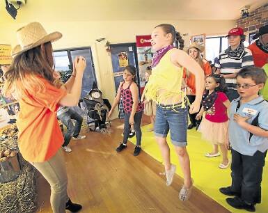 Libby-May Priest, 10, centre, dances during the KidzWish Music and Dance Program for Special Children, funded by Oak Flats Community Bank and Shellharbour branch of Bendigo Bank. Picture: DYLAN ROBINSON