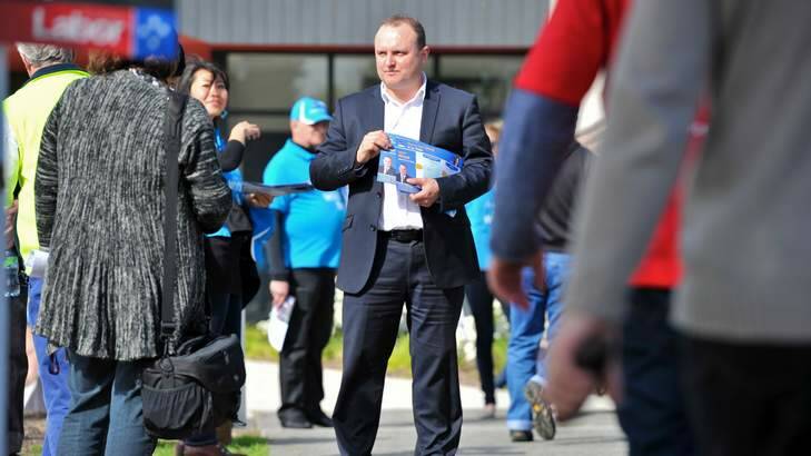 Liberal member Jason Wood hands out how-to-vote cards at Timbarra Primary School in the La Trobe electorate. Photo: Wayne Taylor