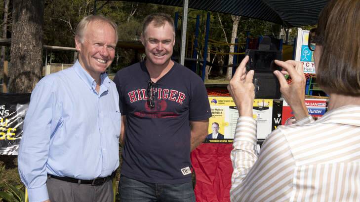 Former Queensland Premier Peter Beattie poses for a photo with Ashley Rose as he campaigns at Eagleby State School. Photo: Harrison Saragossi